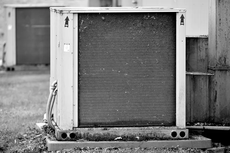 Close-up of an outdoor AC condenser unit